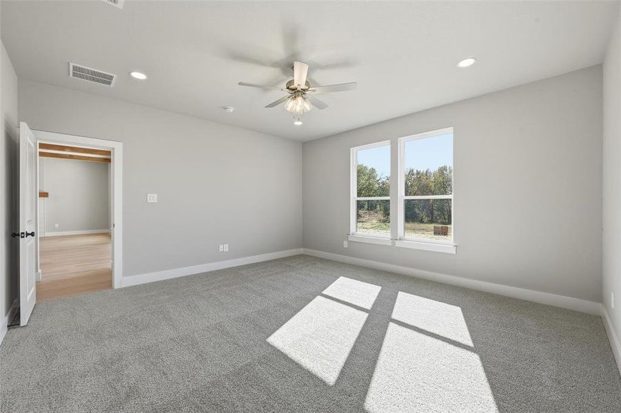 Unfurnished bedroom with recessed lighting, carpet floors, and a ceiling fan Unfurnished bedroom with recessed lighting, carpet floors, and a ceiling fan