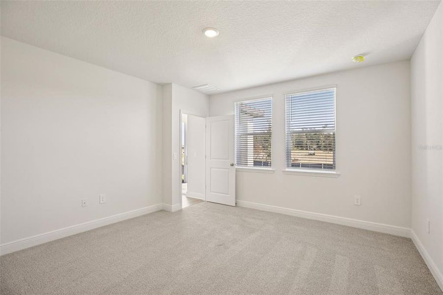 Spacious, unfurnished interior of a new home in The Reserve at Hammock Oaks - Classic Series, Lady Lake (Image 33).