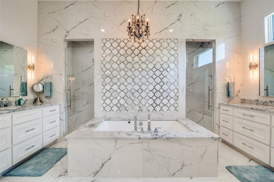 Bathroom featuring plenty of natural light, vanity, tile walls, and tile patterned floors