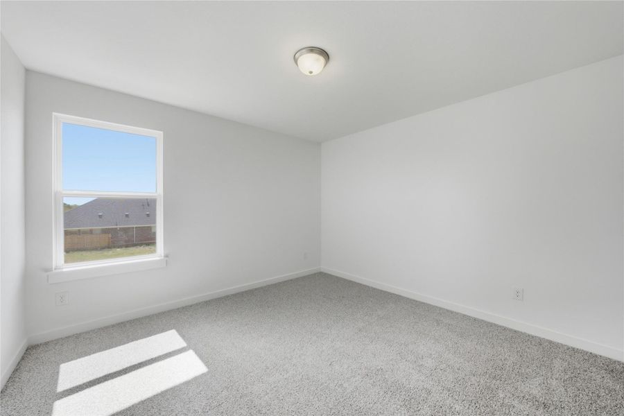 Unfurnished room featuring carpet flooring Unfurnished room featuring carpet flooring