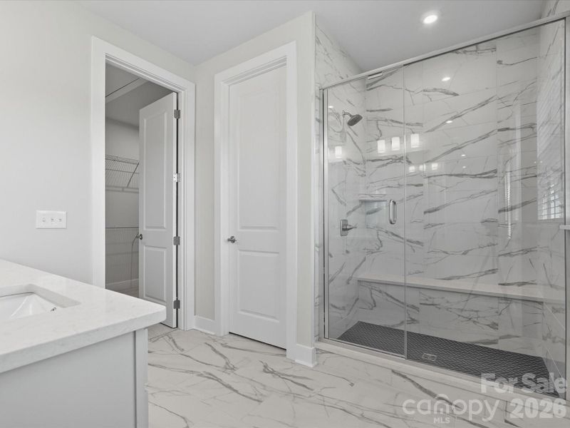 Walk-in shower with tiled shower walls and floor pan Walk-in shower with tiled shower walls and floor pan