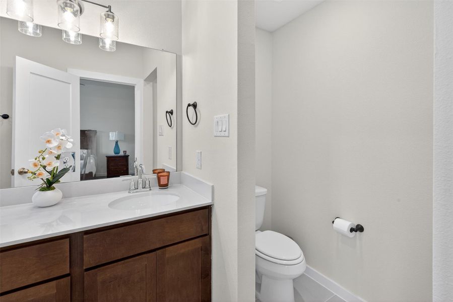 Thoughtfully designed bathroom layout featuring a spacious vanity and a private water closet for added functionality. Thoughtfully designed bathroom layout featuring a spacious vanity and a private water closet for added functionality.