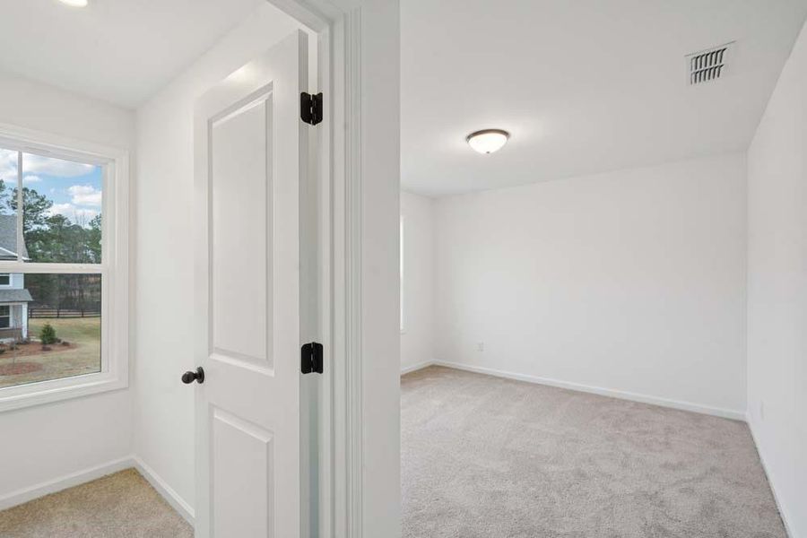 Spacious, unfurnished interior of a new home in Eastlyn Crossing, Flowery Branch (Image 12).