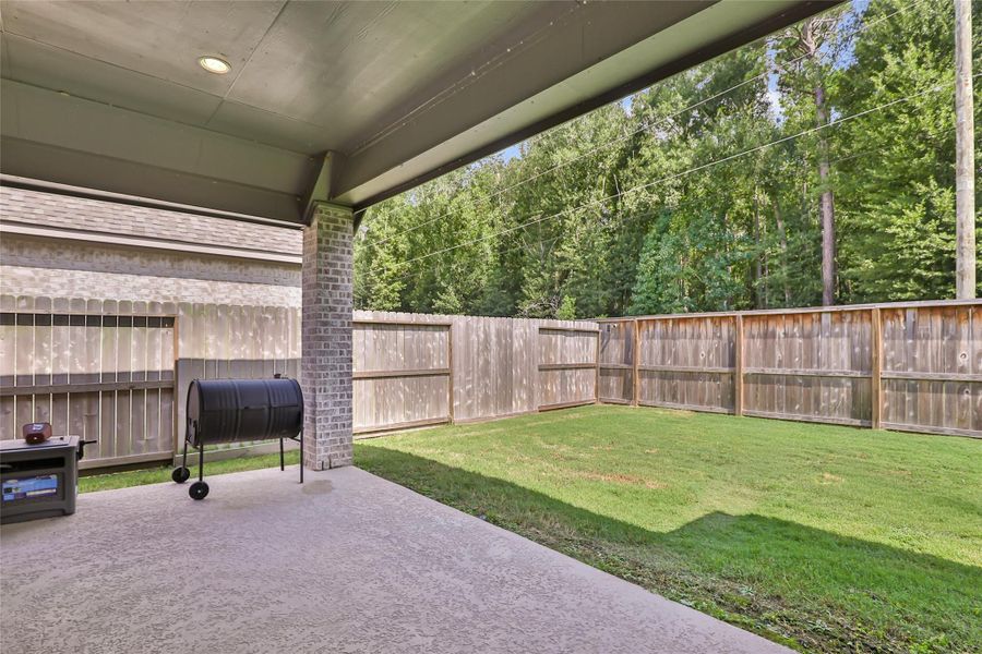 Exterior details and patio area of a home in The Highlands, Porter (Image 26).