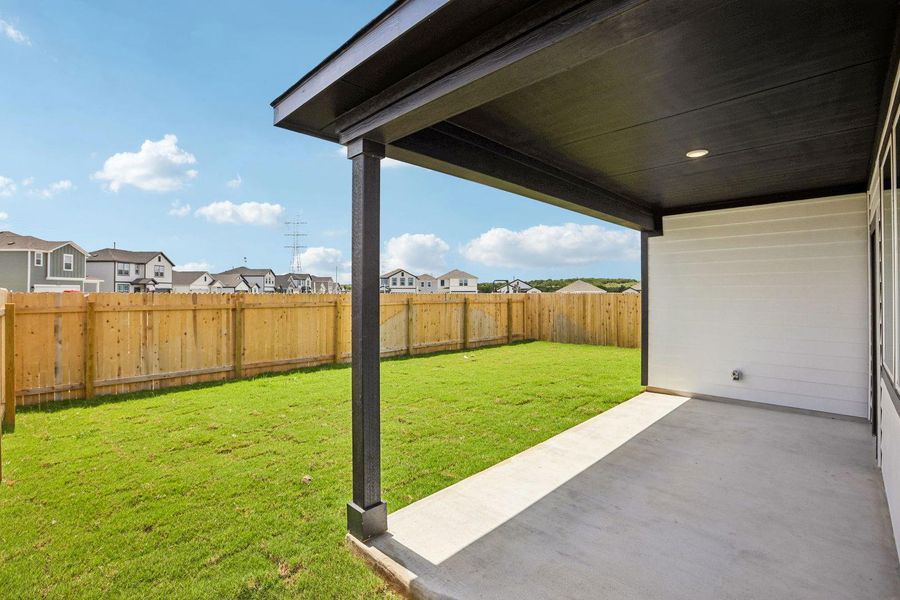 Exterior details and patio area of a home in Stallion Run, Buda (Image 20).