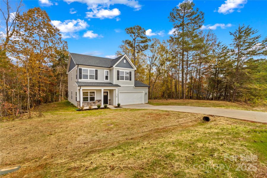 Front exterior of a new home in , Statesville, NC, highlighting curb appeal (Image 1).