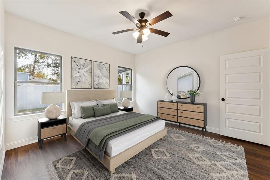 Bedroom with dark wood-style flooring and a ceiling fan