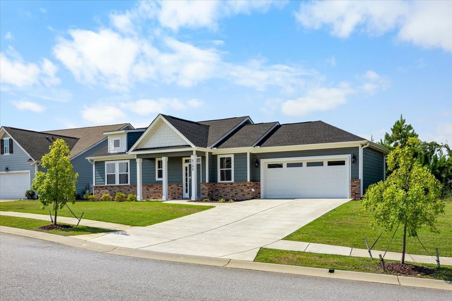 Front exterior of a new home in Sinclair at Crawford Creek, Grovetown, GA, highlighting curb appeal (Image 26). Front exterior of a new home in Sinclair at Crawford Creek, Grovetown, GA, highlighting curb appeal (Image 26).