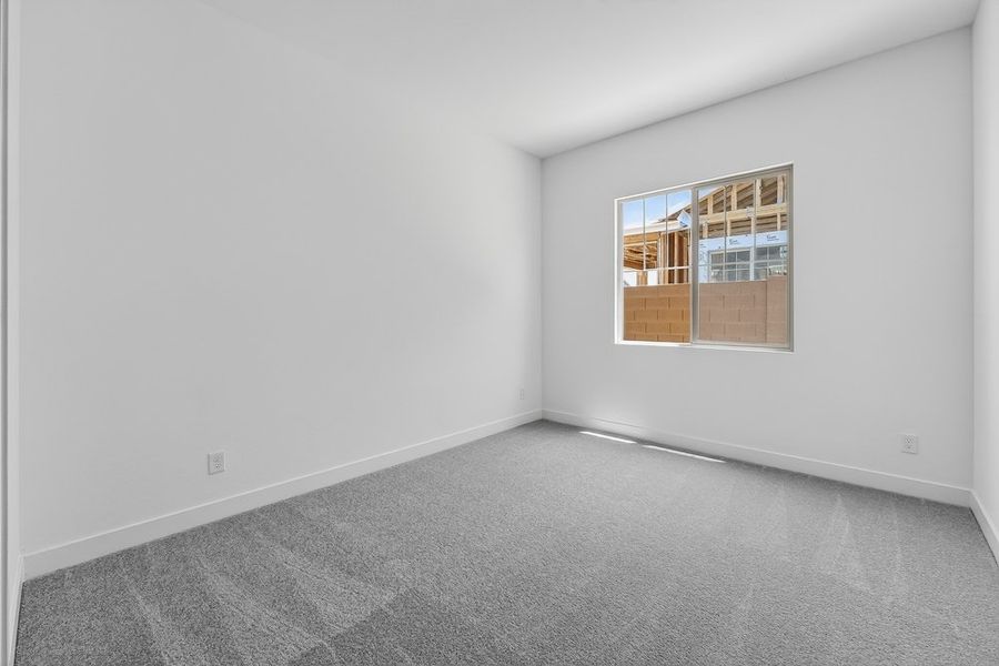 Spacious, unfurnished interior of a new home in Ellsworth Ranch, Queen Creek (Image 24).