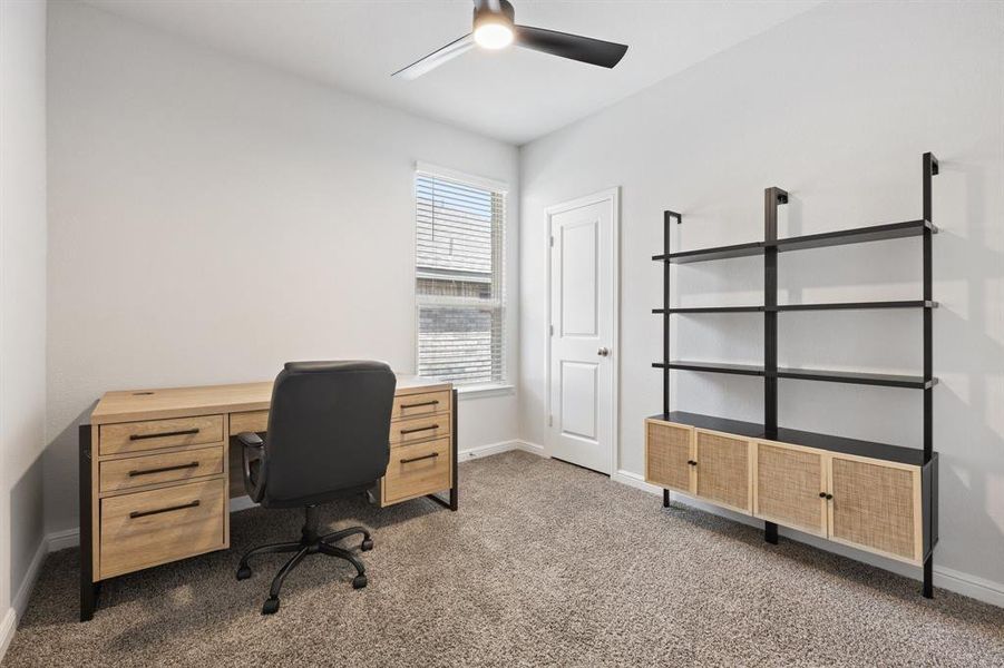 Bedroom #2 or a great office area with ceiling fan, baseboards, and carpet Bedroom #2 or a great office area with ceiling fan, baseboards, and carpet