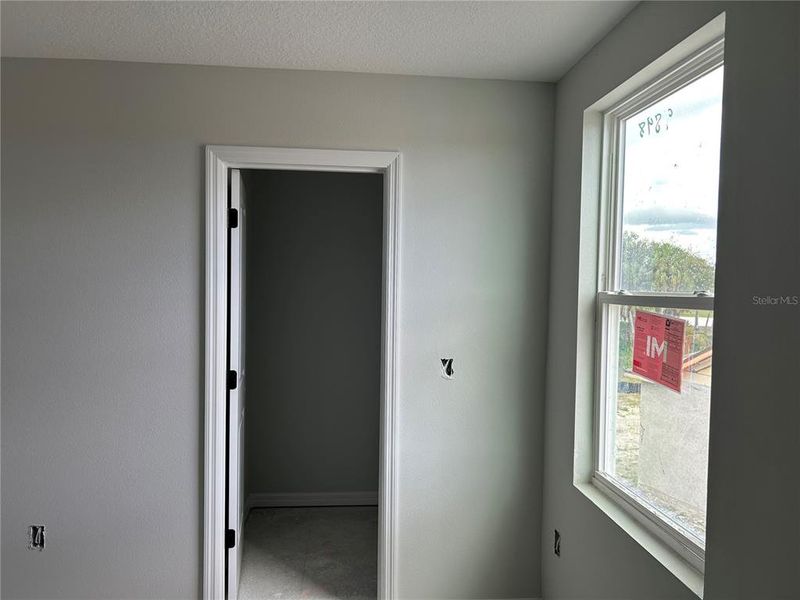 In-progress construction of a new home in Oakfield Trails Signature, Parrish, FL (Image 10).