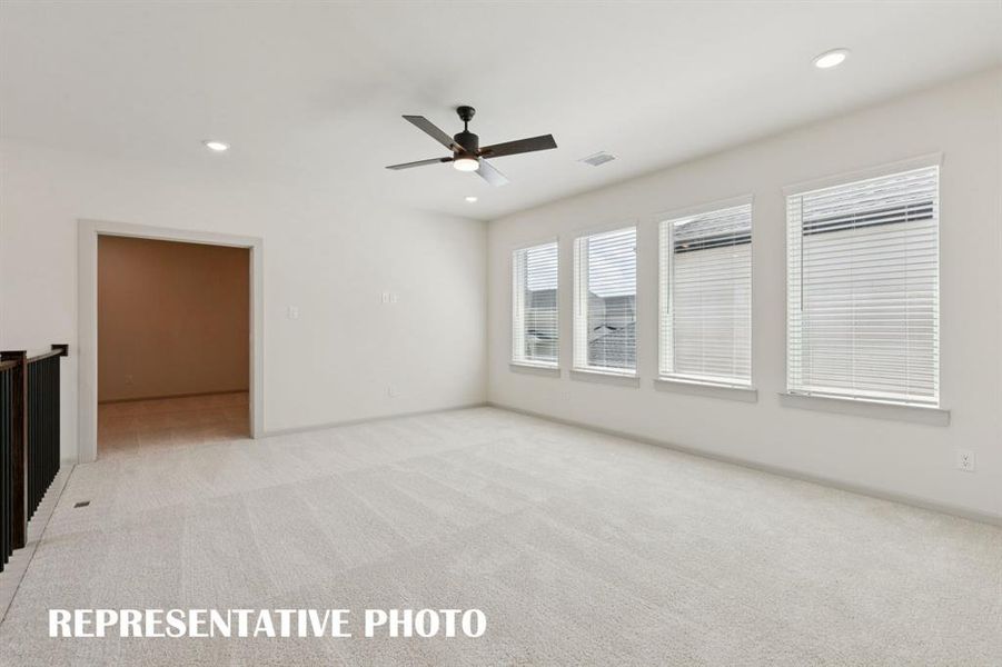 The entire family will enjoy endless fun in this spacious, light filled game room!  REPRESENTATIVE PHOTO