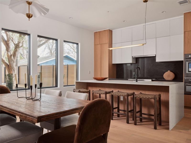 Dining room featuring light wood-style floors and recessed lighting