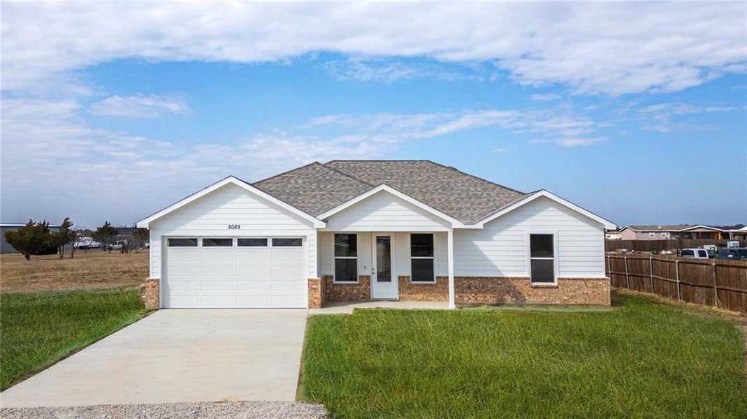 Front exterior of a new home in , Crandall, TX, highlighting curb appeal (Image 14).