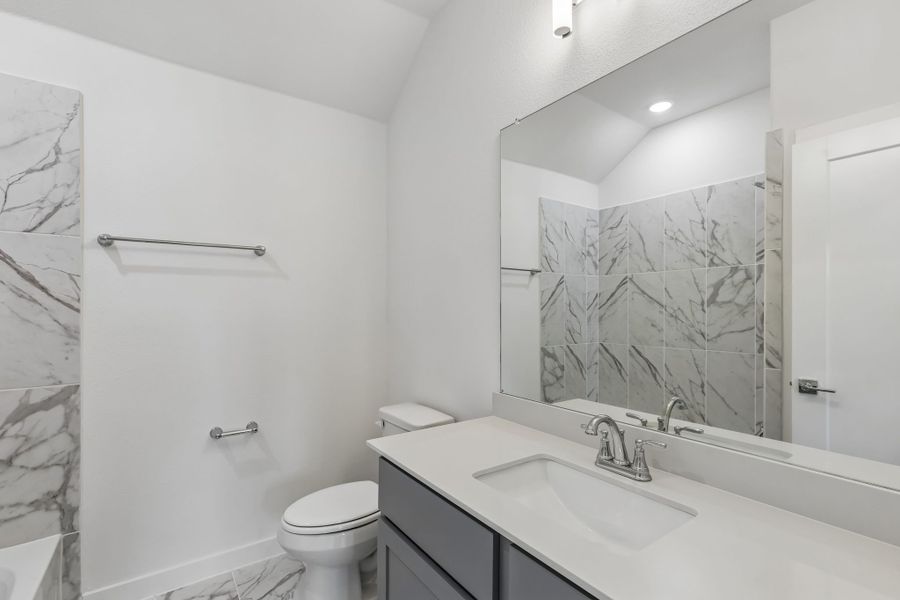 Bathroom in the Claret home plan by Trophy Signature Homes – REPRESENTATIVE PHOTO