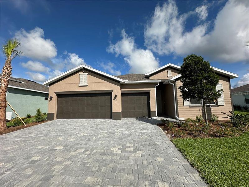 Front exterior of a new home in Rye Ranch, Parrish, FL, highlighting curb appeal (Image 1). Front exterior of a new home in Rye Ranch, Parrish, FL, highlighting curb appeal (Image 1).