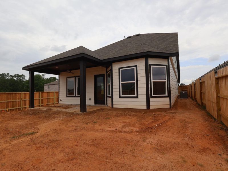 Exterior details and patio area of a home in Moran Ranch, Willis (Image 20).