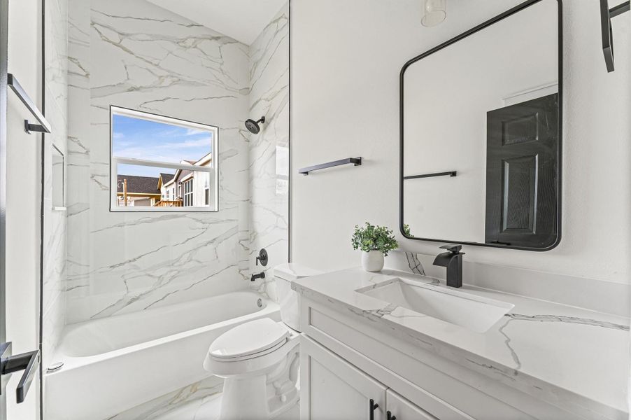 Stylish second bathroom with modern finishes Photos are representative of the same floor plan built by this builder. Finishes will be the same or similar.