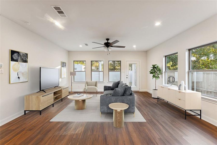 Living area featuring recessed lighting, dark wood-style flooring, and a ceiling fan