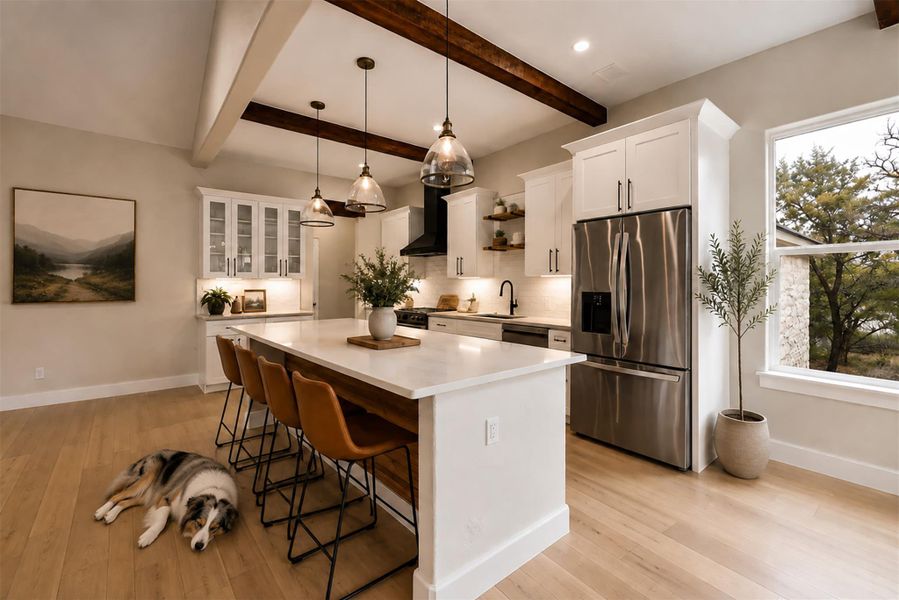 Exposed ceiling beams and rich wood floors add natural warmth to this modern culinary space. Exposed ceiling beams and rich wood floors add natural warmth to this modern culinary space.