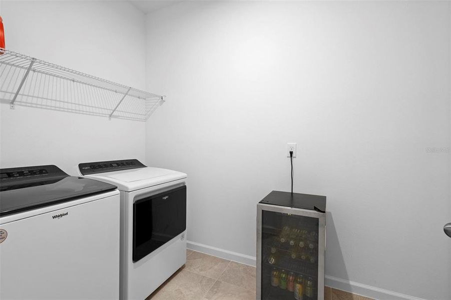 Inside laundry room next to garage entrance