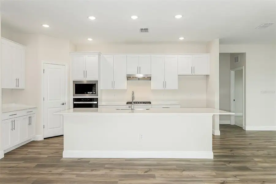 Furnished interior view inside a new home in Pasadena Woods, Dade City (Image 7).