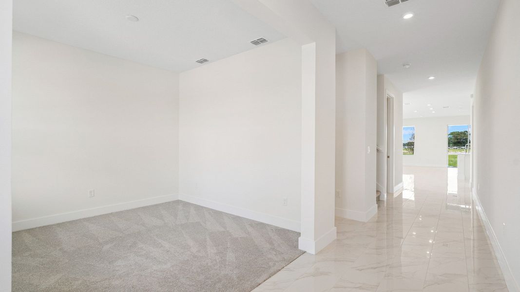 The Sweetgum front room flex space on left of entry two story home in Trailside in Mount Dora by DRB Homes