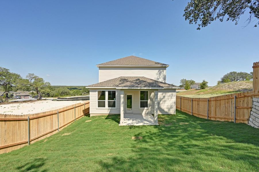 Front exterior of a new home in Creekside at Estancia, Austin, TX, highlighting curb appeal (Image 20).