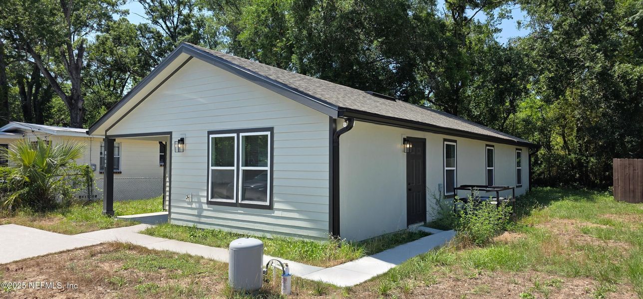 Front exterior of a new home in , Jacksonville, FL, highlighting curb appeal (Image 2).