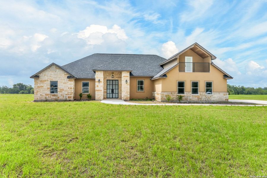 Front exterior of a new home in , Bandera, TX, highlighting curb appeal (Image 2). Front exterior of a new home in , Bandera, TX, highlighting curb appeal (Image 2).