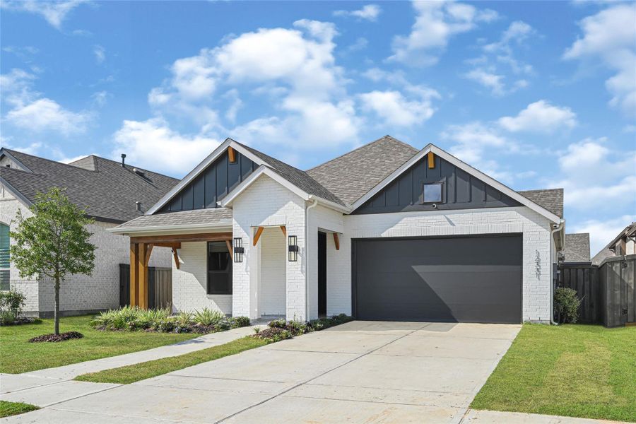 Front exterior of a new home in Riceland, Mont Belvieu, TX, highlighting curb appeal (Image 2). Front exterior of a new home in Riceland, Mont Belvieu, TX, highlighting curb appeal (Image 2).