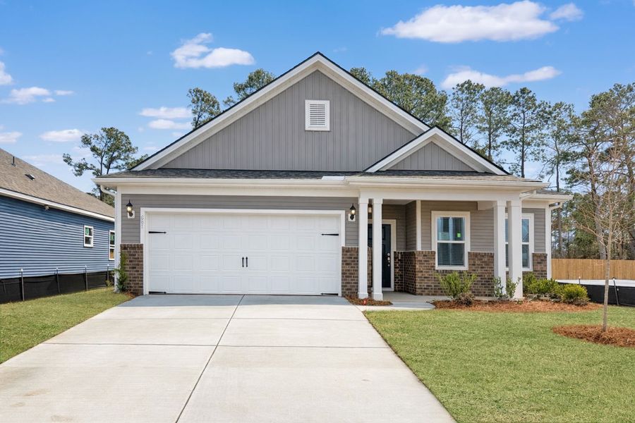 Front exterior of a new home in Crescent Cove, Myrtle Beach, SC, highlighting curb appeal (Image 2). Front exterior of a new home in Crescent Cove, Myrtle Beach, SC, highlighting curb appeal (Image 2).