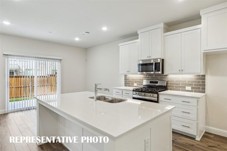 Light, bright and airy, this open concept kitchen-dining- area is everything you have been searching for!  REPRESENTATIVE PHOTO