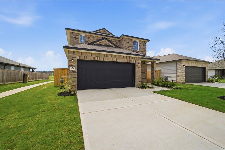 Front exterior of a new home in Colony at Pinehurst, Pinehurst, TX, highlighting curb appeal (Image 2).