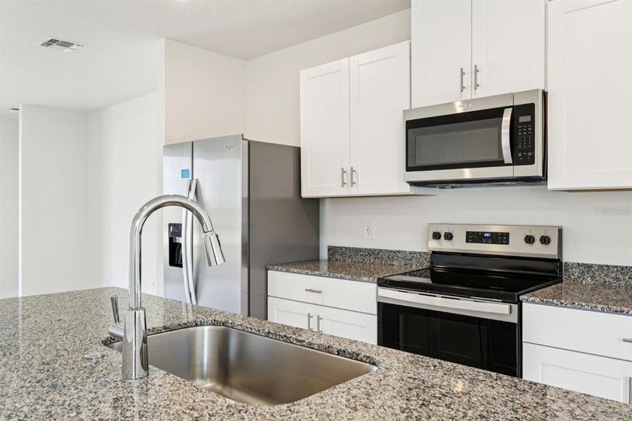 Furnished interior view inside a new home in Springs at Lake Alfred - Classic Series, Lake Alfred (Image 5).
