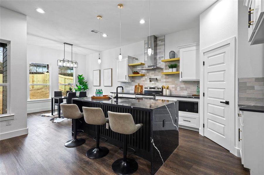 Kitchen with electric stove, wall chimney range hood, dark wood-style floors, open shelves, and dark countertops