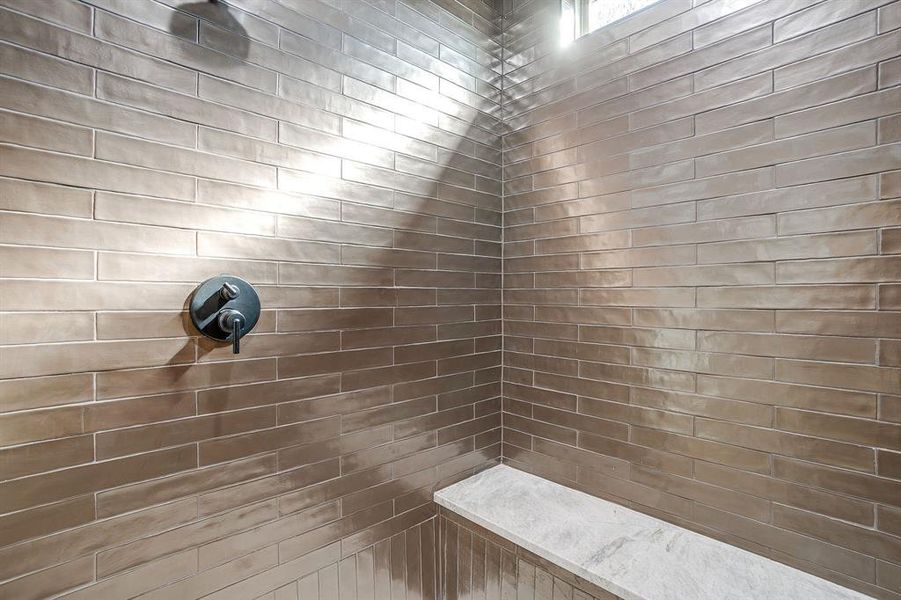 Spa-inspired bathroom with dual vanity, quartzite countertops, and Delta fixtures. Spa-inspired bathroom with dual vanity, quartzite countertops, and Delta fixtures.