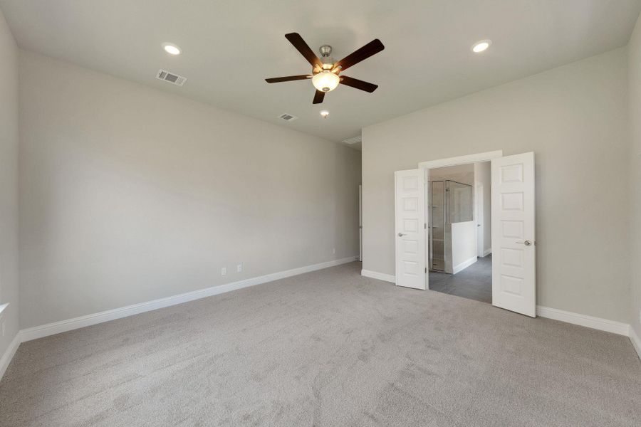 Unfurnished bedroom with dark carpet, recessed lighting, and ceiling fan Unfurnished bedroom with dark carpet, recessed lighting, and ceiling fan