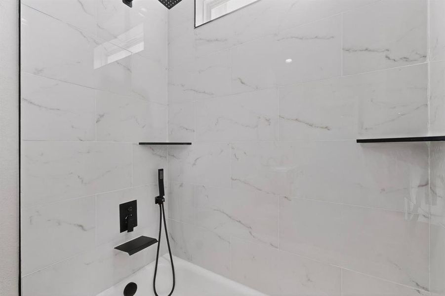 Full bathroom with a marble finish shower Full bathroom with a marble finish shower