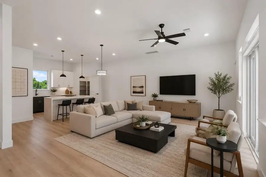 Expansive open concept living and dining area on the second floor designed for effortless entertaining with refined modern elegance