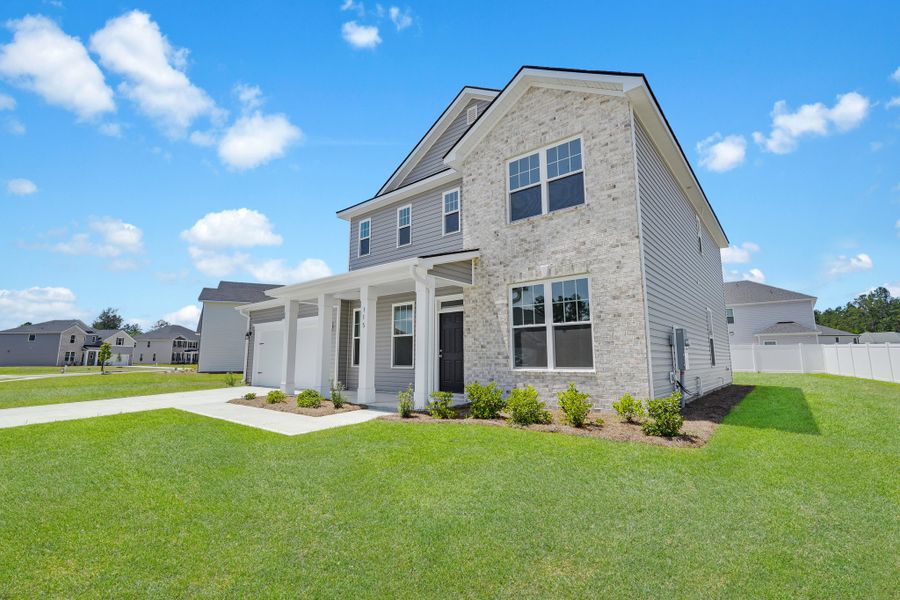 Front exterior of a new home in Camden Crossing, Savannah, GA, highlighting curb appeal (Image 22).