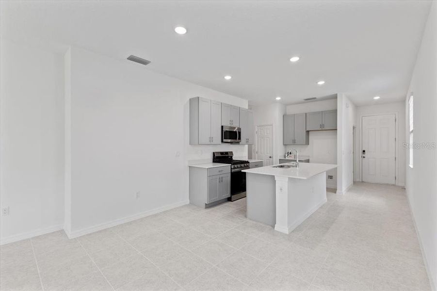 Furnished interior view inside a new home in Highfield at Twisted Oaks, Wildwood (Image 3).