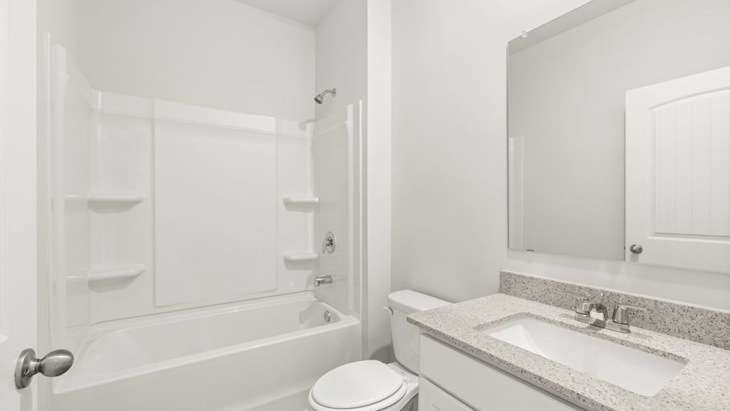 Representative furnished interior of a home built from the Hayden by D.R. Horton in Liberty Crossing, Braselton (Image 9).