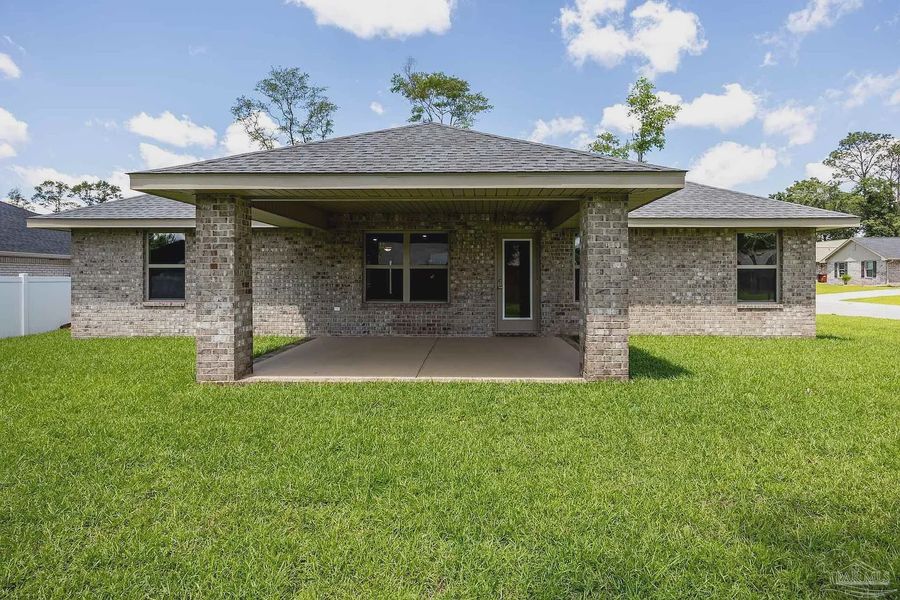Front exterior of a new home in Emmaline Gardens, Milton, FL, highlighting curb appeal (Image 2). Front exterior of a new home in Emmaline Gardens, Milton, FL, highlighting curb appeal (Image 2).