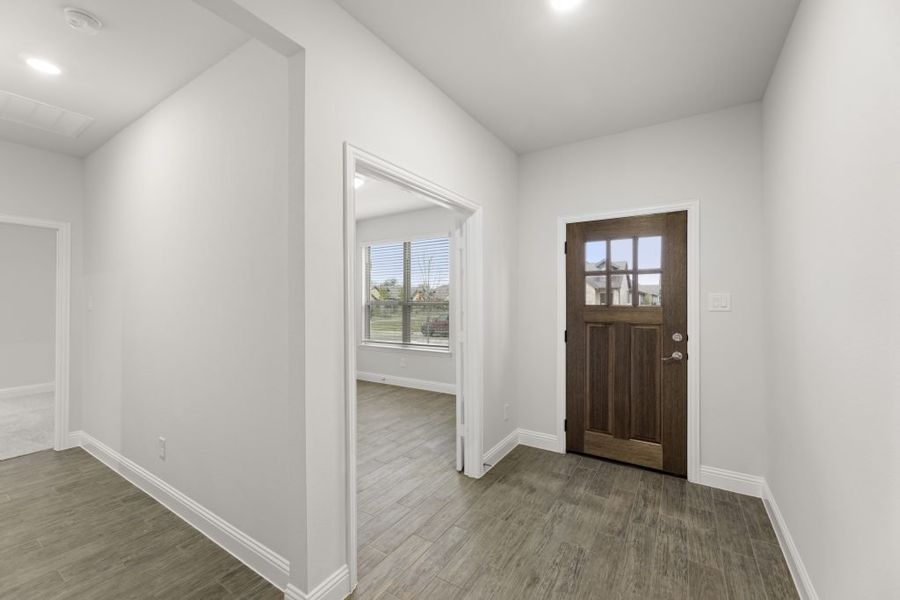 Front exterior of a new home in Redden Farms – Active Adult, Midlothian, TX, highlighting curb appeal (Image 6).
