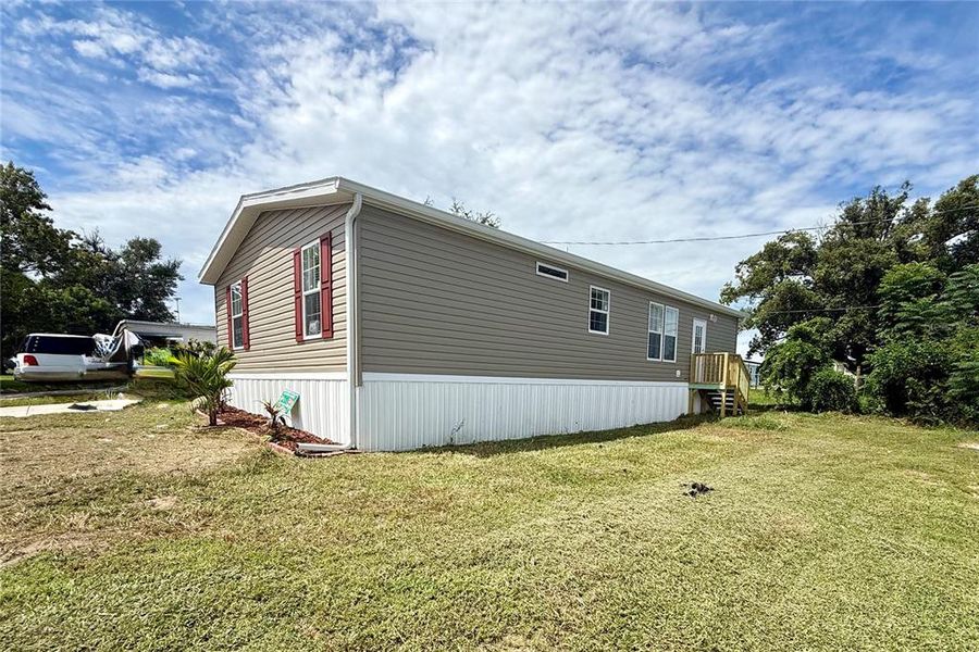 Front exterior of a new home in , Zephyrhills, FL, highlighting curb appeal (Image 13).