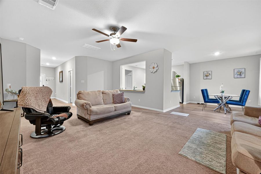 Alternate view of the living room looking onto the main entrance. Alternate view of the living room looking onto the main entrance.