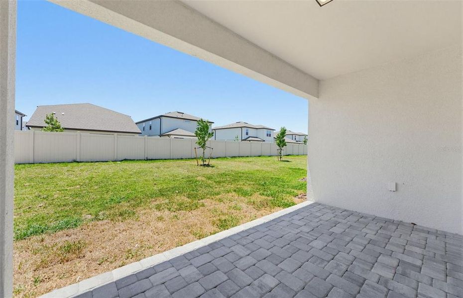 Exterior details and patio area of a home in Vida's Way, Wesley Chapel (Image 3).