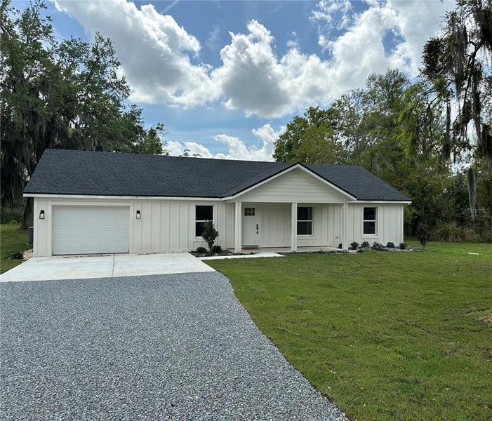 Front exterior of a new home in , Lakeland, FL, highlighting curb appeal (Image 1).