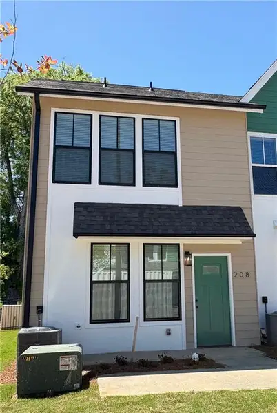 Front exterior of a new home in Avenue at Oakland City, Atlanta, GA, highlighting curb appeal (Image 1).